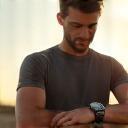 Lucas checking time outdoors